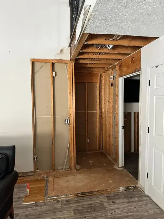 Wall framing opened up to dry after a water loss