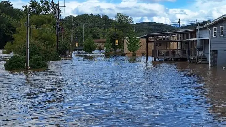 Flooded street and homes after heavy rain in a Middle Tennessee town